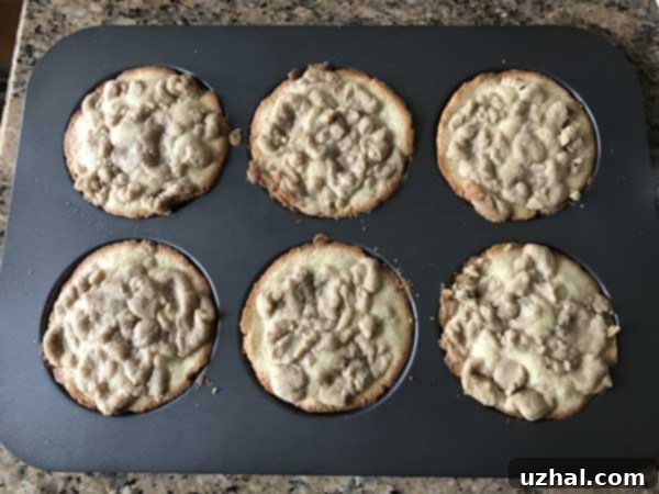 Muffin top pan with freshly baked items, highlighting ease of cleaning