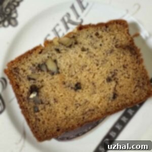 Slice of Best Ever Banana Bread made with two bananas.