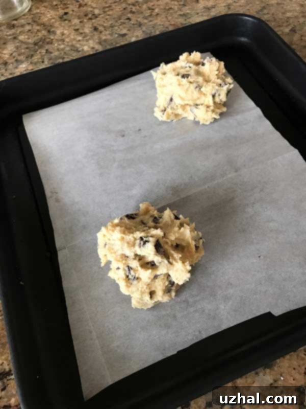 Close-up of a giant crinkled chocolate chip cookie with melted chocolate