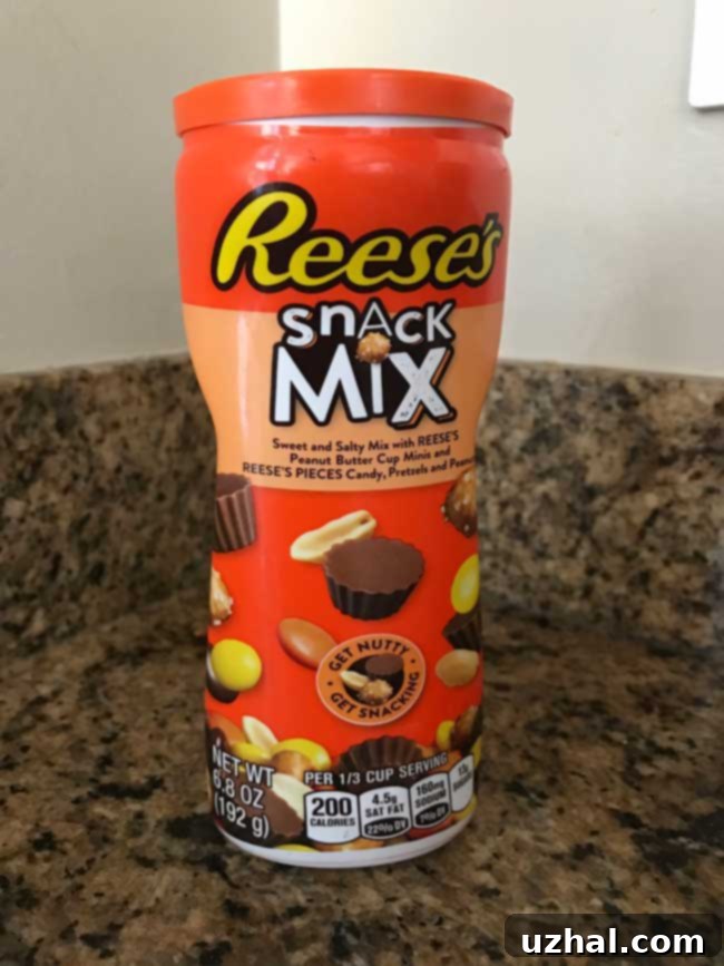 Reese's Snack Mix container, showcasing the delicious components inside, ready to be used as a cookie topping.