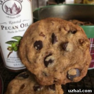 Crispy roasted pecan chocolate chip cookies cooling on a rack