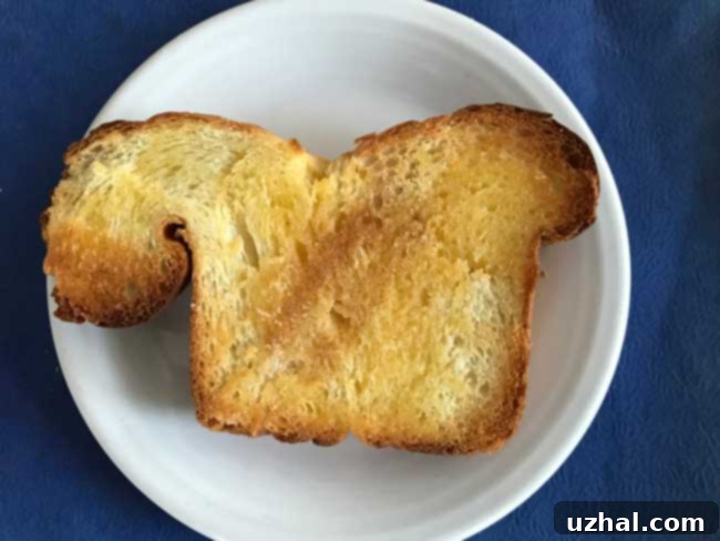 Freshly baked Japanese Milk Bread loaf, golden brown and ready to be enjoyed