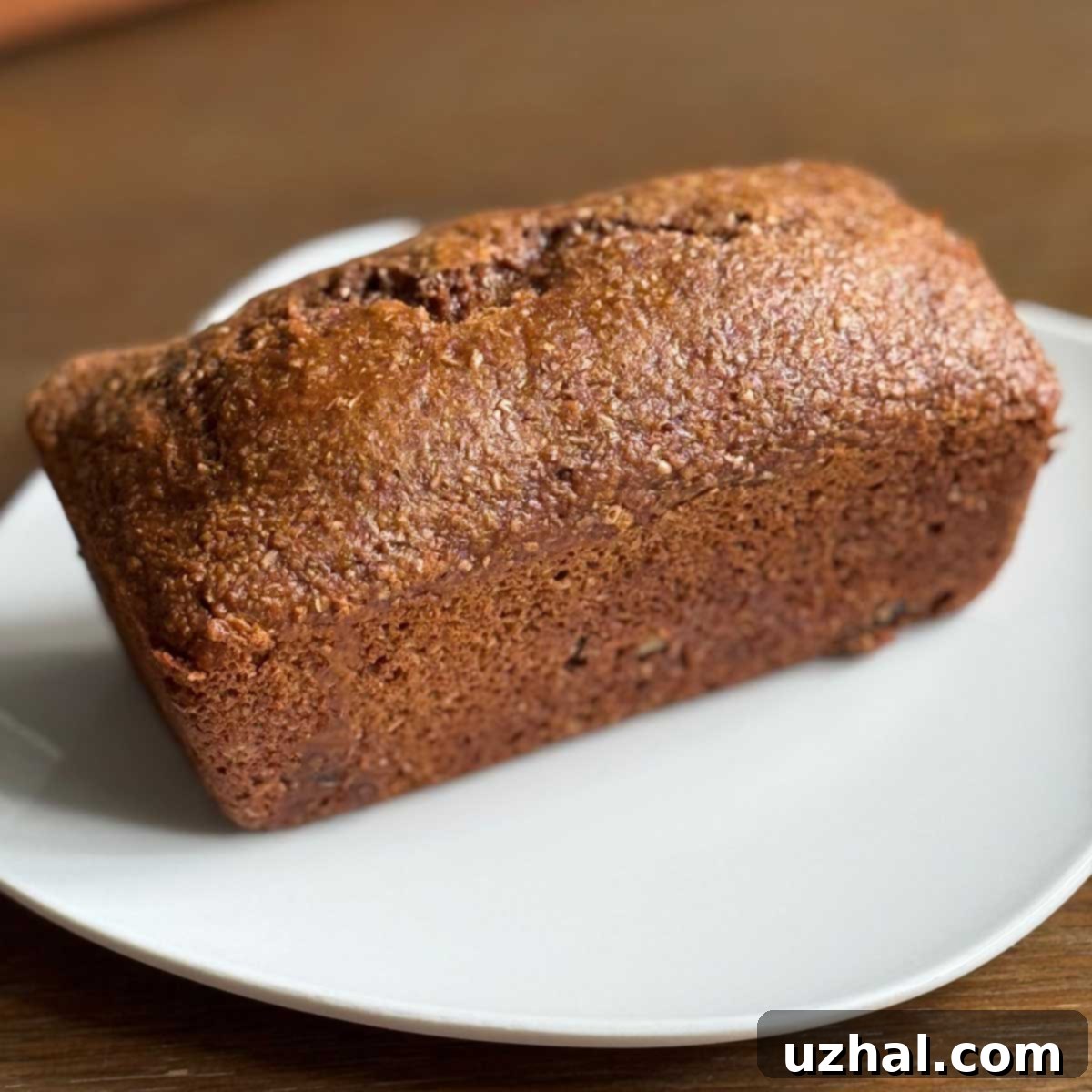 Close-up of a slice of the eggless Bran Cake Bread.