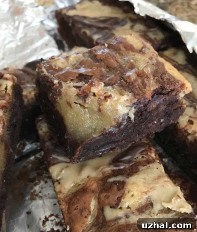 Four perfectly portioned Tahini Brownies arranged on a serving plate.