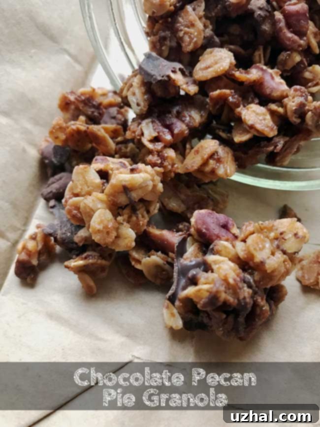 Rich Chocolate Pecan Pie Granola clusters on a baking sheet, perfect for holiday gifting