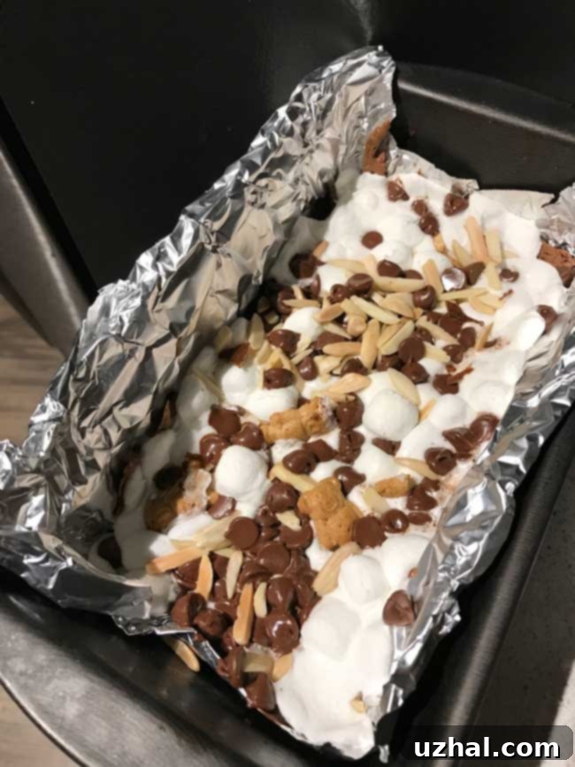 Rocky Road Loaf Pan Brownies cooling on a rack, ready to be sliced