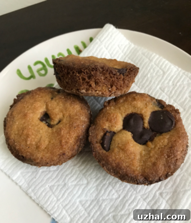 Close-up of freshly baked Muffin Tin Keto Chocolate Chunk Cookies with melted chocolate visible