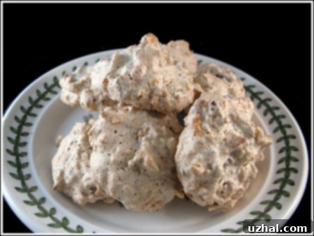 Golden brown Corn Flakes Macaroons on a baking sheet, showcasing their chewy texture and crunchy exterior