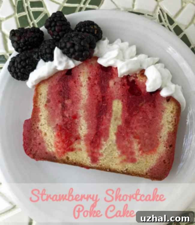 Vibrant Strawberry Shortcake Poke Cake, a Jell-O cake made with moist pound cake, garnished with fresh berries and whipped cream.