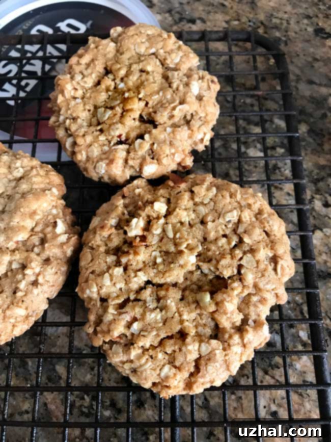 Freshly baked Crunchy Hearty Oatmeal Cookies on a cooling rack