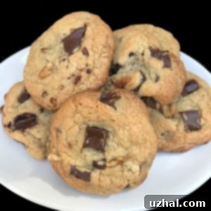 A stack of perfectly baked Light and Dark Brown Sugar Chocolate Chip Cookies