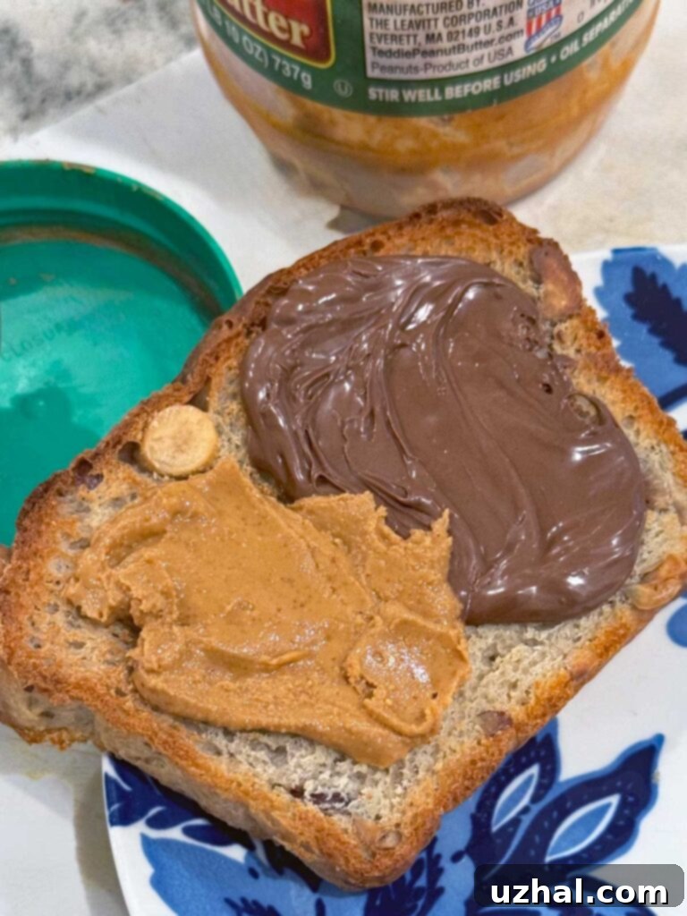 Hazelnut Bread toasted and spread with peanut butter and Nutella, showing a rich golden crust and soft interior.