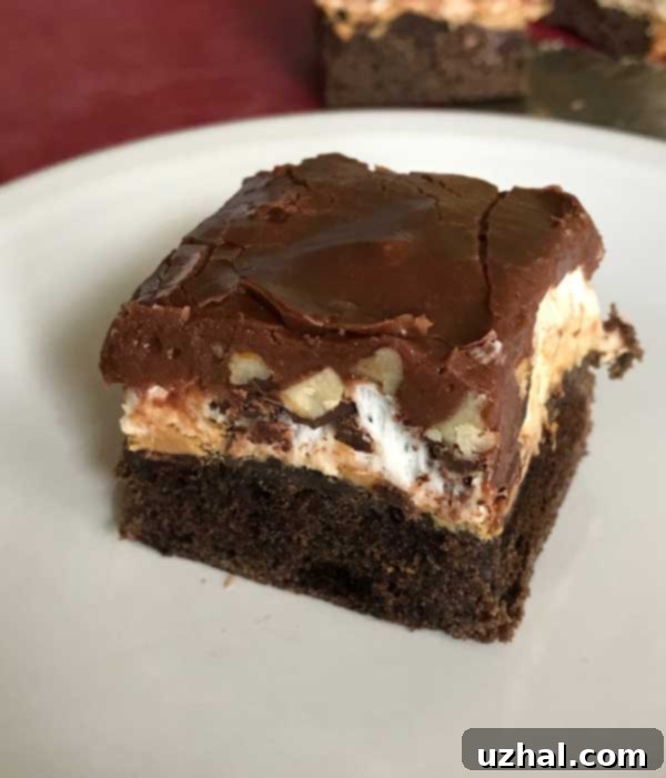 Freshly baked Small Batch Mississippi Mud Bars in an 8-inch square pan, ready for the next layer