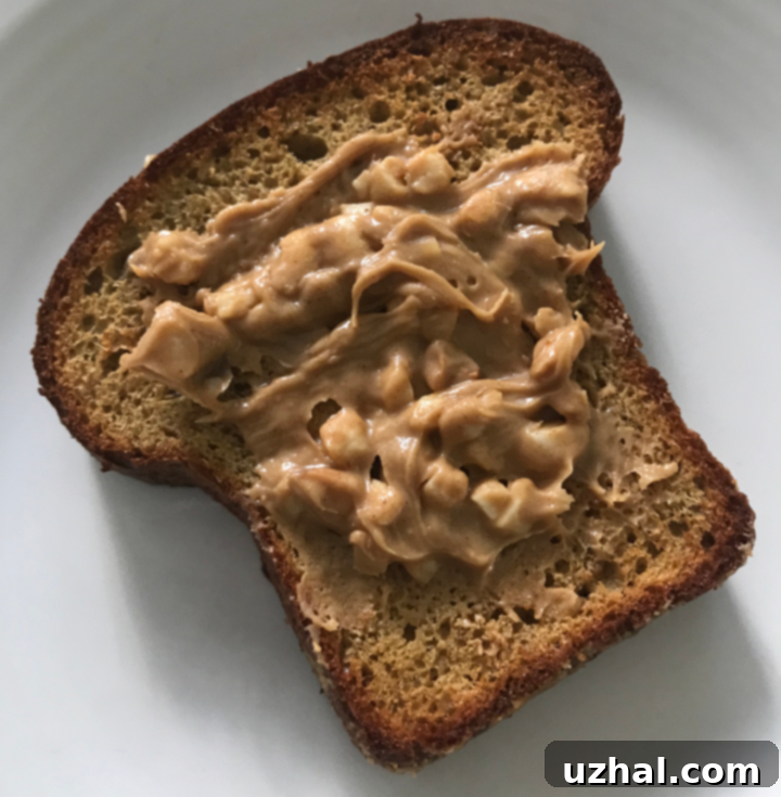 Toast with peanut butter made with a low carb bread recipe, topped with chia seeds.