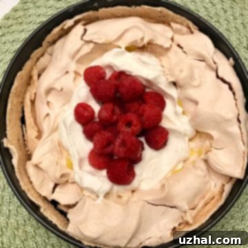 Pavlova with Lemon Curd, Whipped Cream and Berries