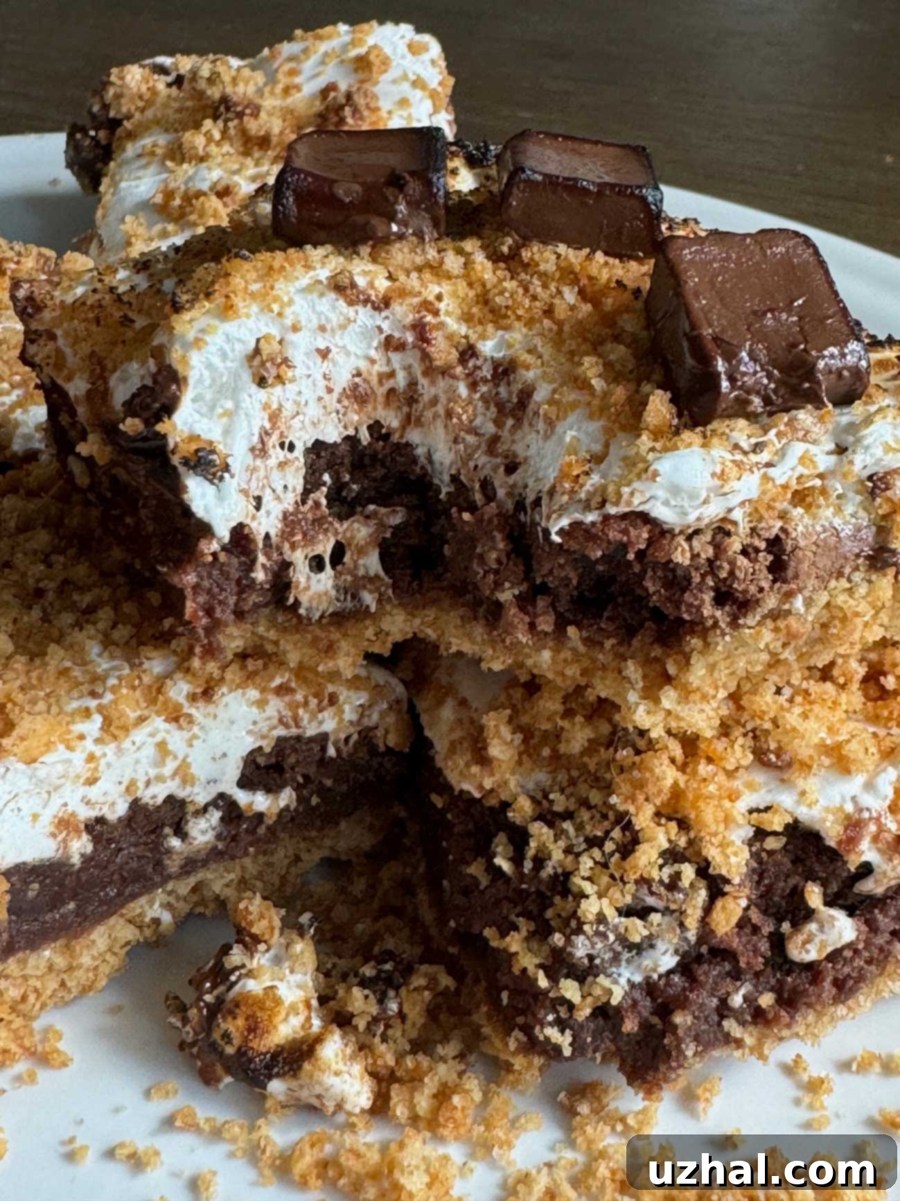 Gooey S'more's Bars with Marshmallow Creme - a decadent dessert with layers of graham cracker, brownie, and toasted marshmallow