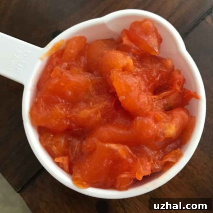Close-up of Fuyu persimmon pulp in a bowl, ready for baking.