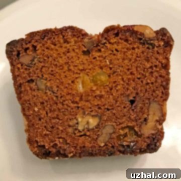 Persimmon Bread with Pecans and Bourbon Raisins, sliced to show texture.