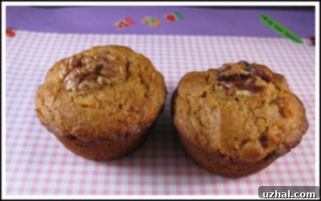 Freshly baked carrot walnut muffins cooling on a wire rack