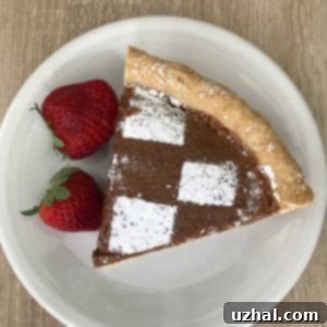 A freshly baked Chocolate Chess Pie in a pie plate.