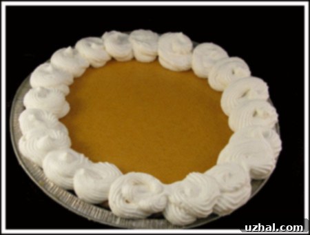 Sliced Sweet Potato Pie ready to be served, showcasing its smooth texture and golden-brown crust.