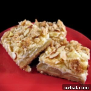 Apple Almond Cheesecake Bars with a creamy filling and crumbly topping