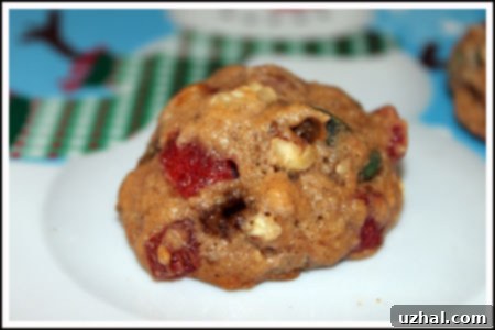 Close-up of baked bourbon cookies featuring a rich texture and visible pieces of candied fruit.