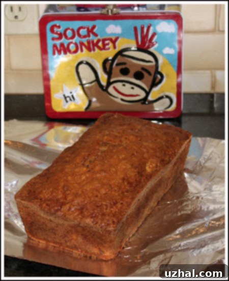 Two freshly baked loaves of Make-Ahead Zucchini Apple Bread, golden brown and ready to be enjoyed or frozen.