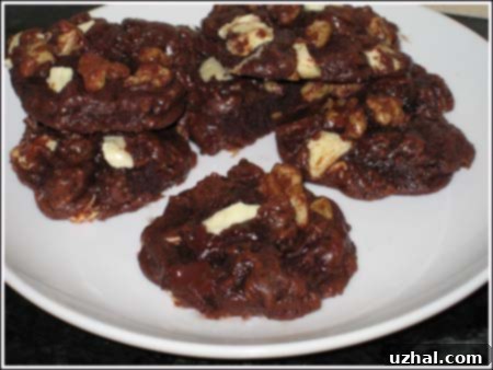 Bowl of chocolate cookie dough, showing its thick and glossy texture