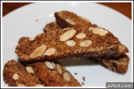A close-up shot of freshly baked coconut sugar almond biscotti, showcasing its golden-brown color and almond pieces.