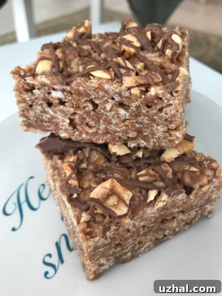 Close-up of Chocolate Hazelnut Rice Krispies Treats, showcasing their crispy texture and chocolate drizzle.