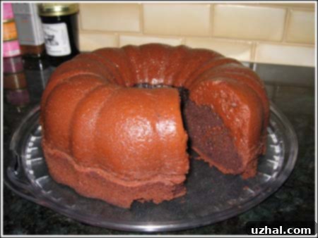 Decadent Chocolate Cheesecake Bundt Cake with creamy cheesecake swirl and chocolate glaze