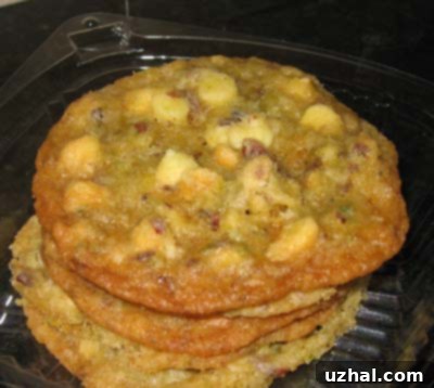 Close-up of baked Hazelnut Lime Pepper Cookies, some with white chocolate chips mixed in.