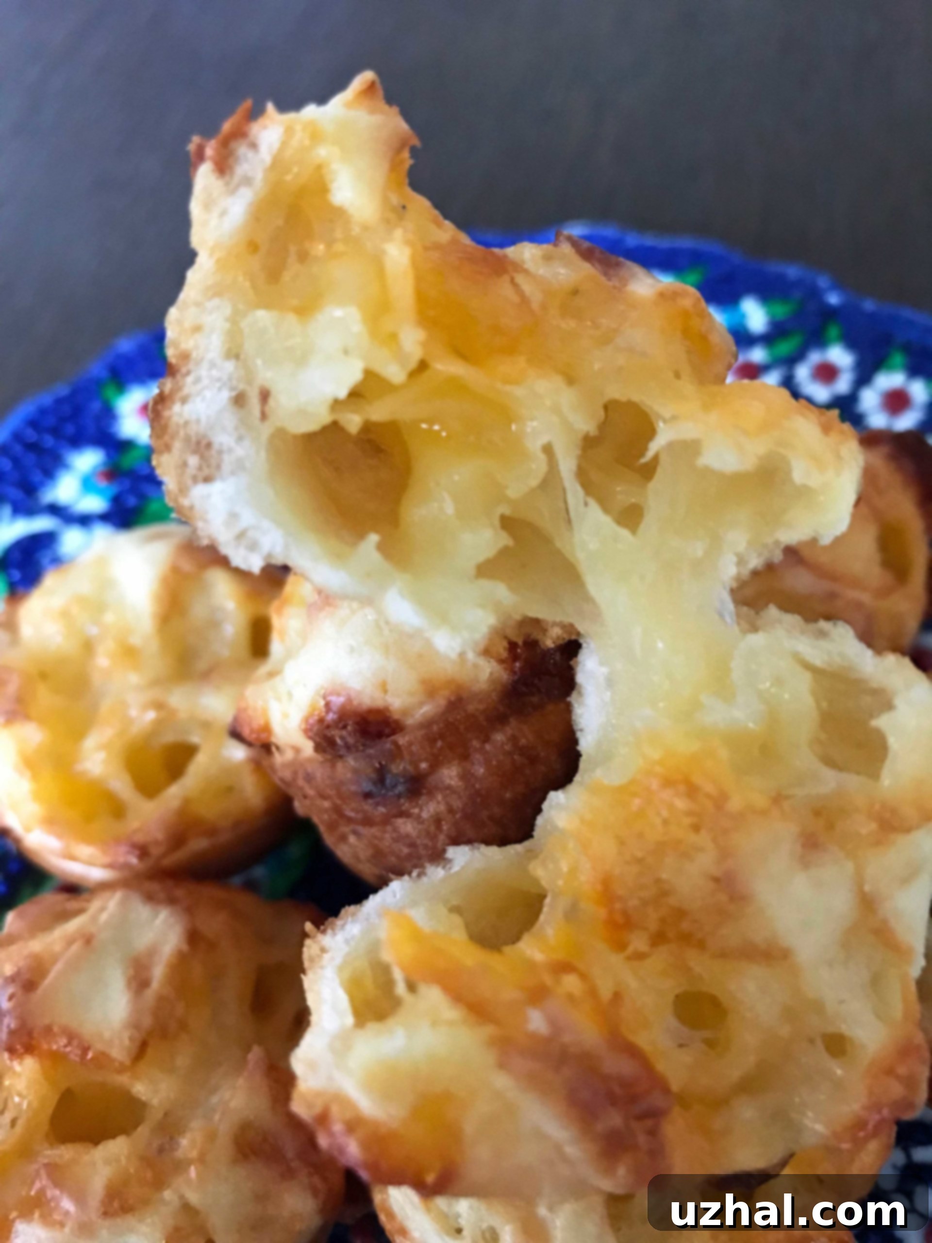 Gluten-Free Cheddar Cheese Breads inspired by Brazilian Cheese Bread, golden brown and ready to eat.