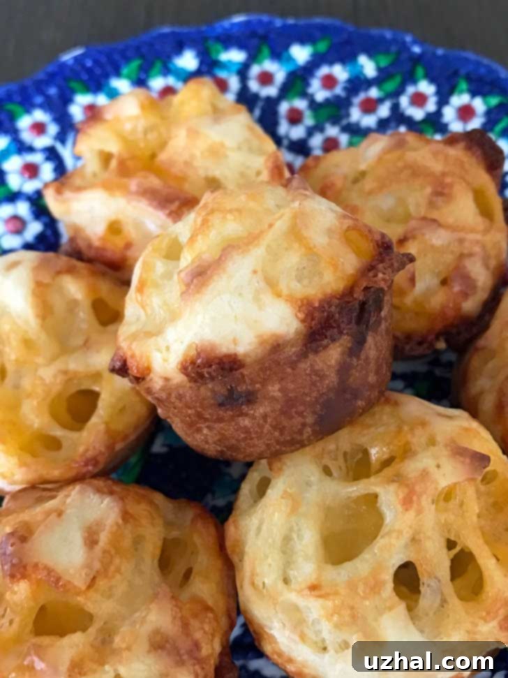 Gluten-Free Cheddar Cheese Breads similar to Brazilian Cheese Bread, arranged on a serving plate.