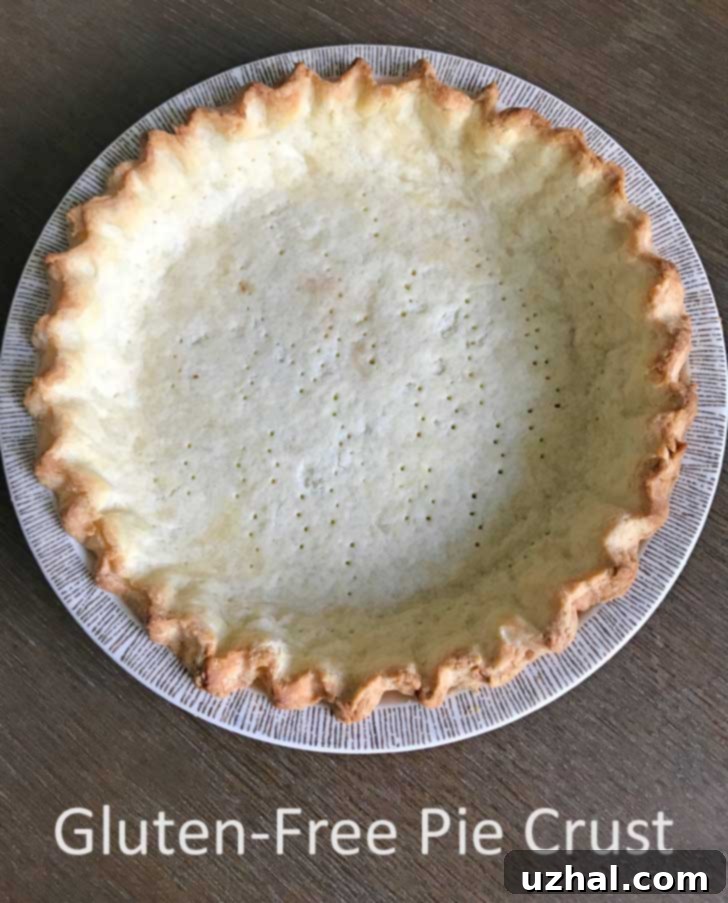 An empty, golden-brown baked gluten-free pie crust made with Thomas Keller's Cup4Cup flour blend, ready for filling.