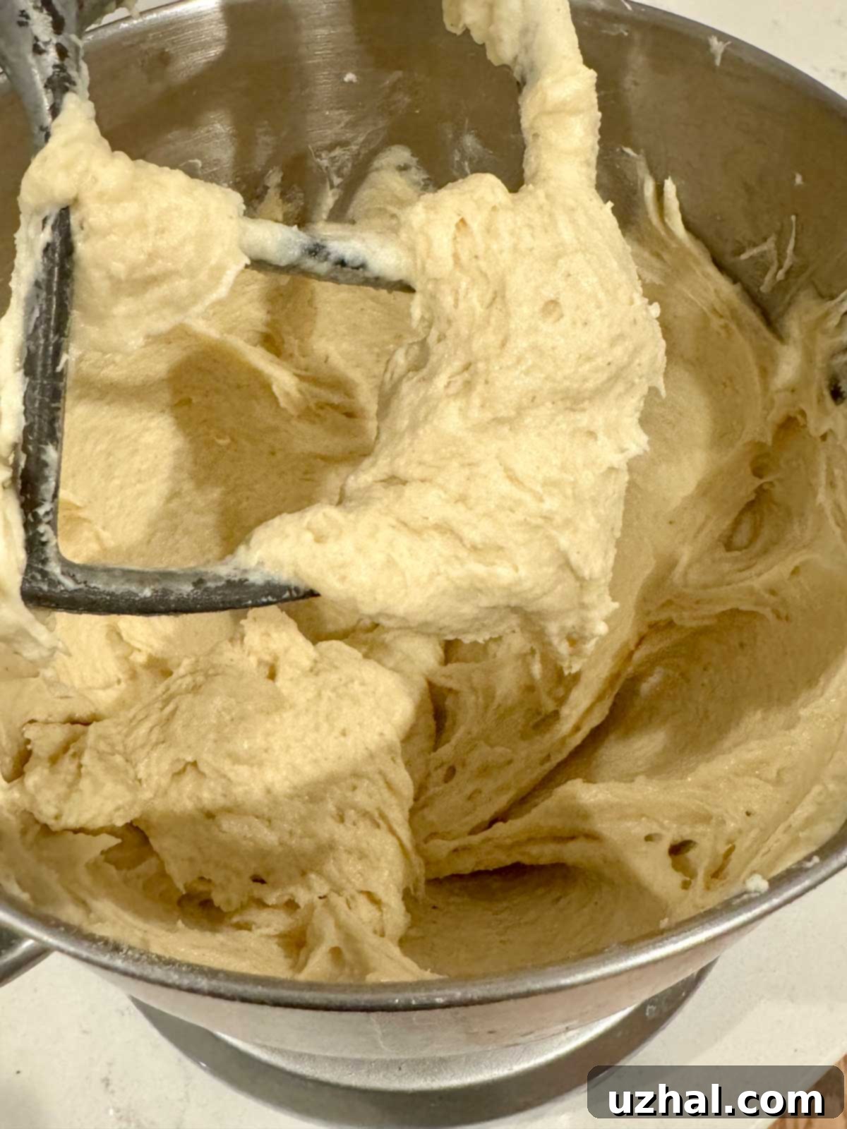 Gluten-Free Bread Dough in a mixing bowl, resembling a thick batter