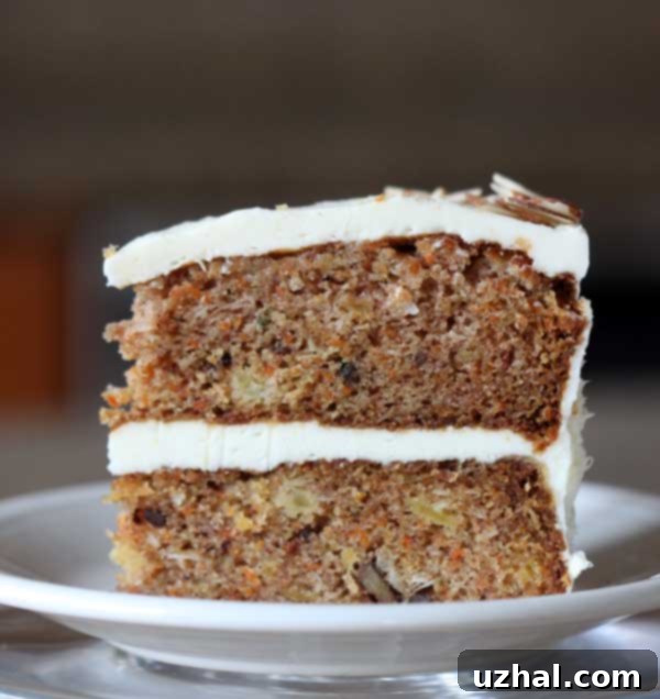 Beautifully frosted two layer carrot cake with rich cream cheese frosting