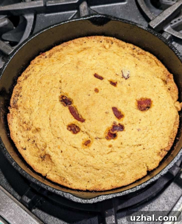 Close-up of a slice of Chipotle Bacon Cornbread revealing texture