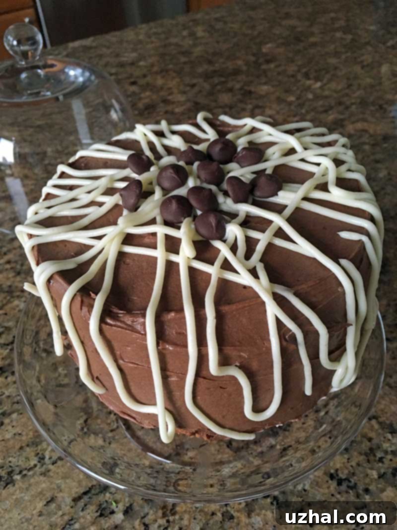 Perfectly baked yellow cake topped with generous chocolate frosting.