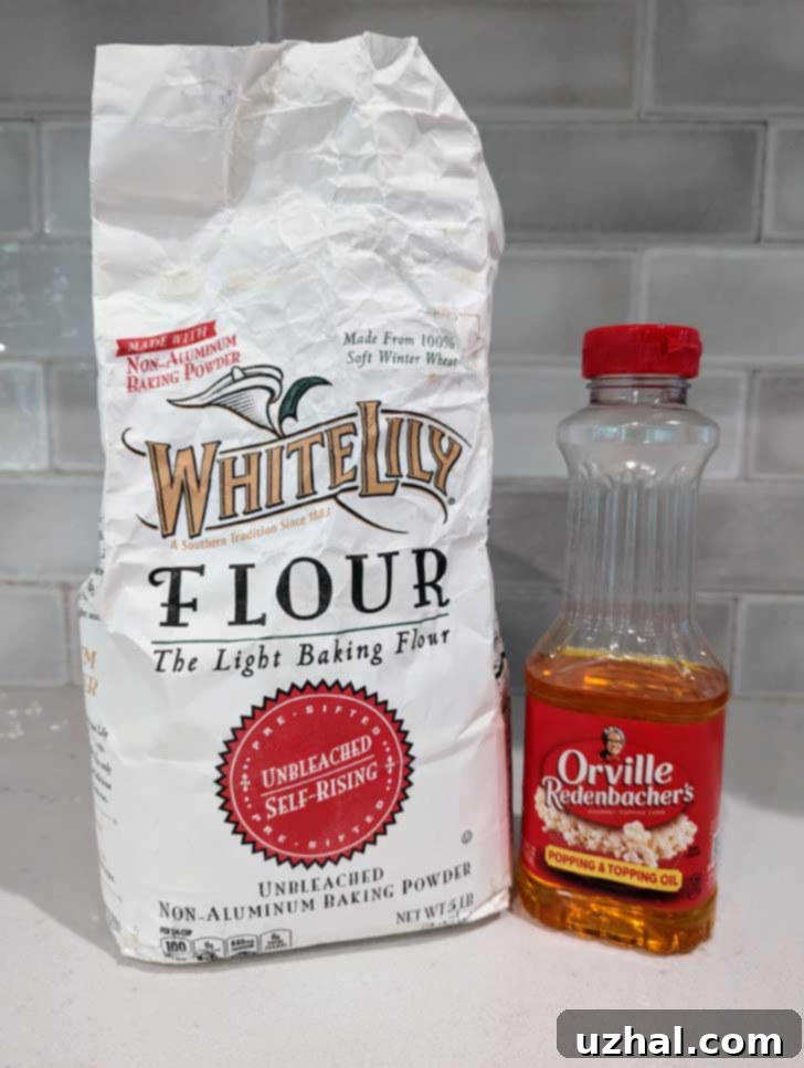 Ingredients for Easy Cottage Cheese Muffins: White Lily self-rising flour and Orville Redenbacher's Popping & Topping Oil side by side.