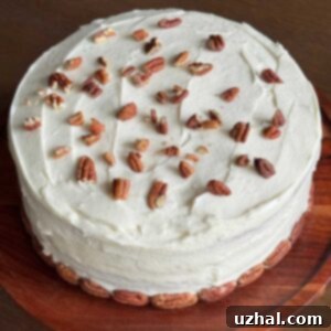 Delicious Italian Cream Cake recipe from Texas, garnished with toasted pecans.