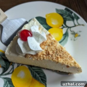 Lime Delicious Cheesecake with a perfect slice ready to be served