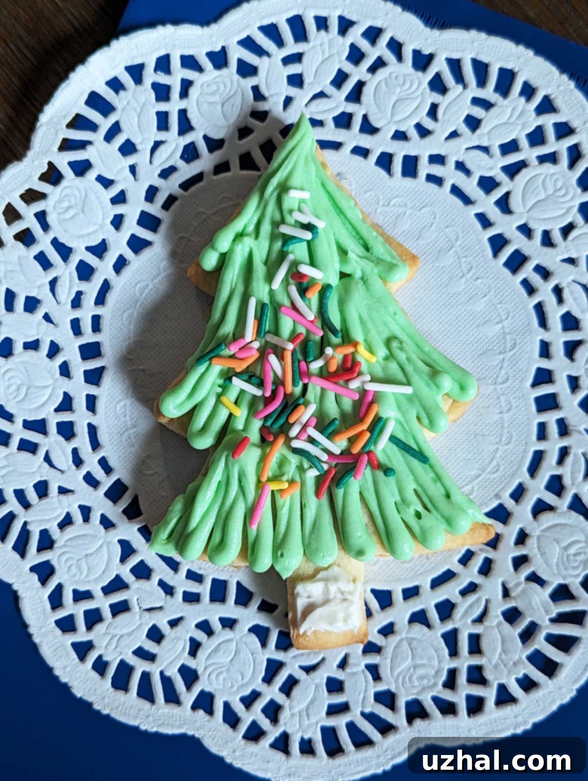 Beautifully decorated cut-out Christmas tree sugar cookie, showcasing the cookie's ability to hold its shape.