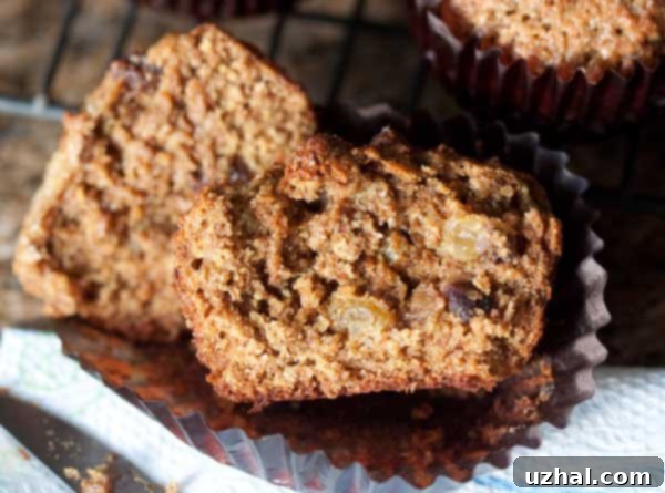 A perfectly split bran muffin revealing its moist, tender, and airy interior texture