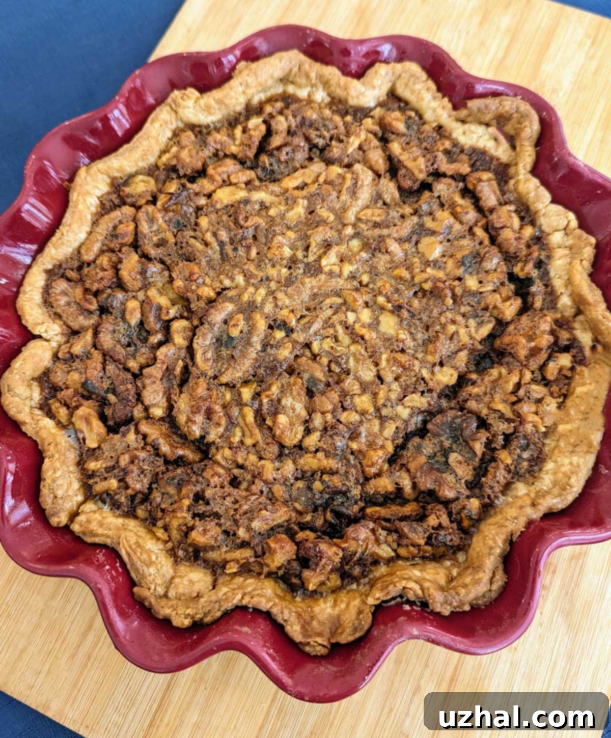 Homemade Walnut Pie with a slightly over-browned crust edge, illustrating baking tips for pie dishes.