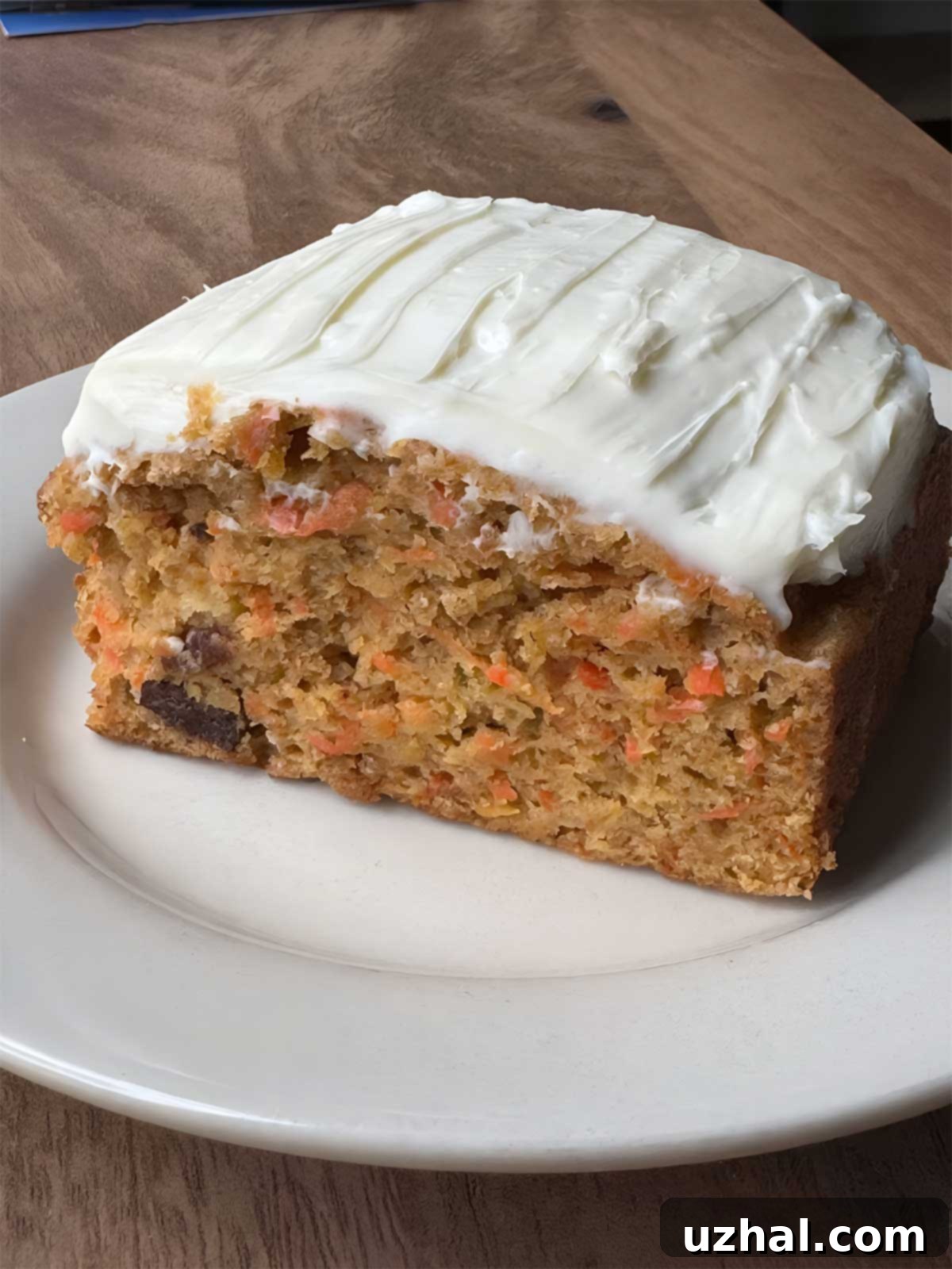 Cooking Light magazine carrot cake recipe with a reduced sugar cream cheese icing. A perfectly baked carrot cake topped with a generous layer of creamy, light cream cheese frosting.