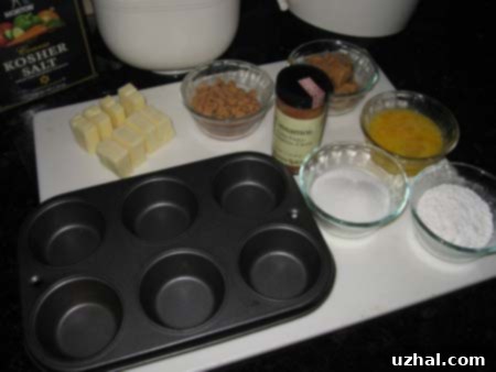 Step 1: Thoroughly buttering and sugaring the muffin cups for peanut butter lava cakes