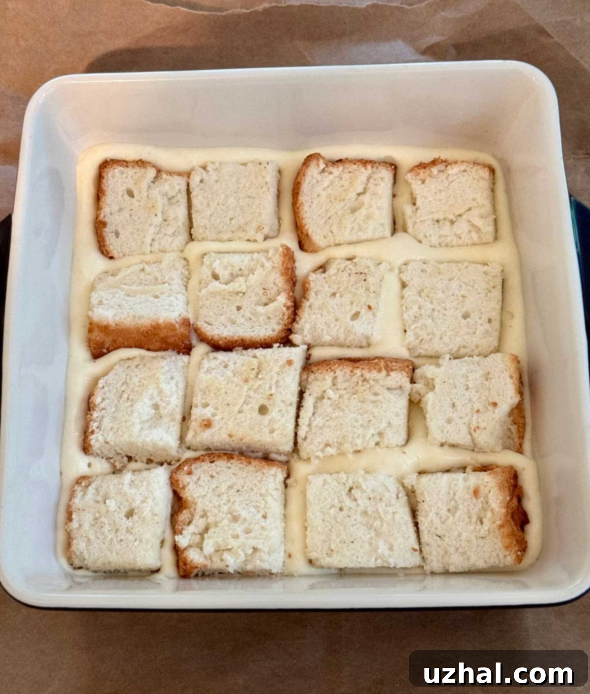 Close-up of fluffy angel food cake chunks mixed with creamy Bavarian cream.