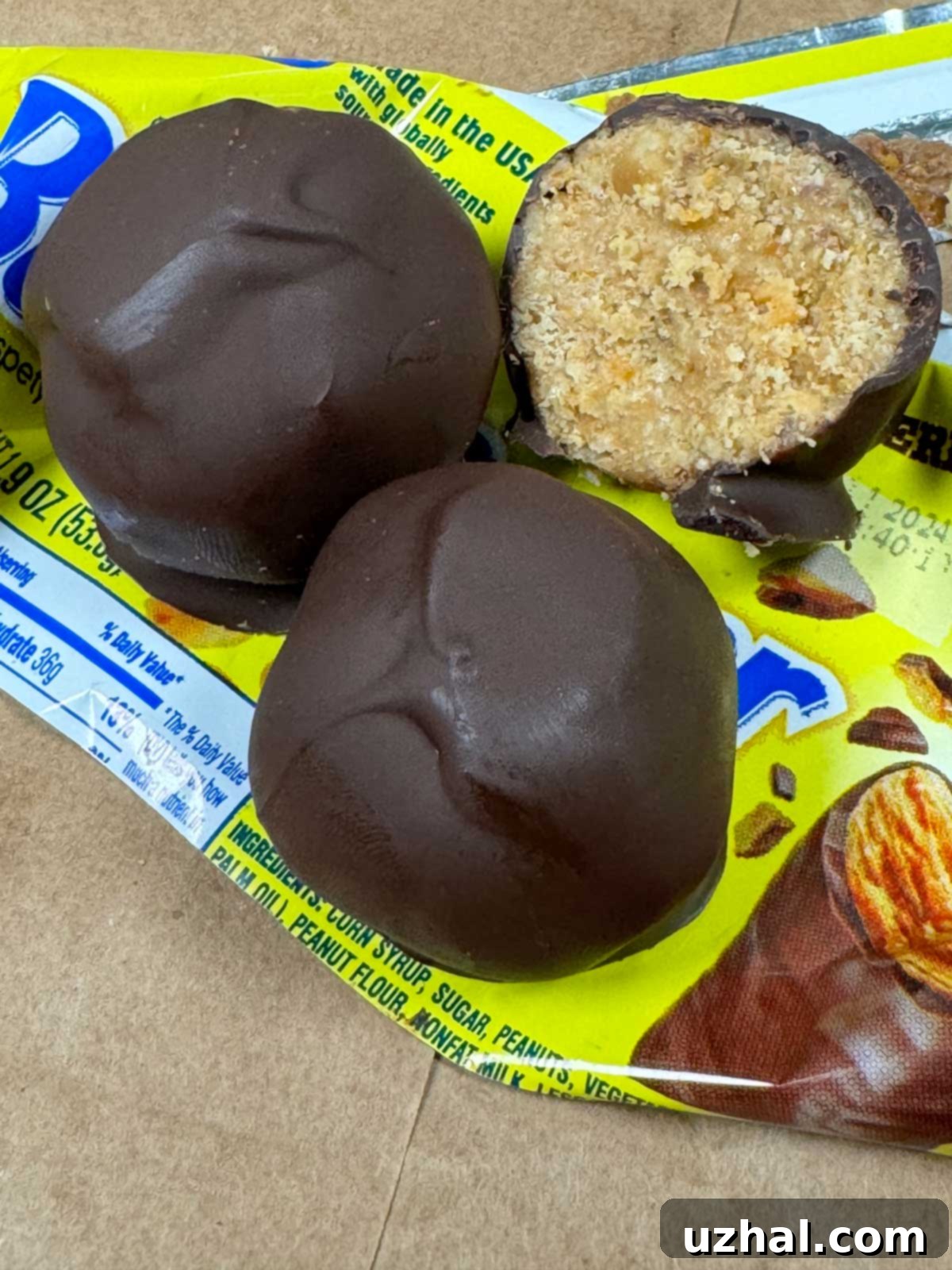 No-Bake Peanut Butter Butterfinger Balls with Corn Flakes, a crunchy chocolate covered treat perfect for parties and snacks.